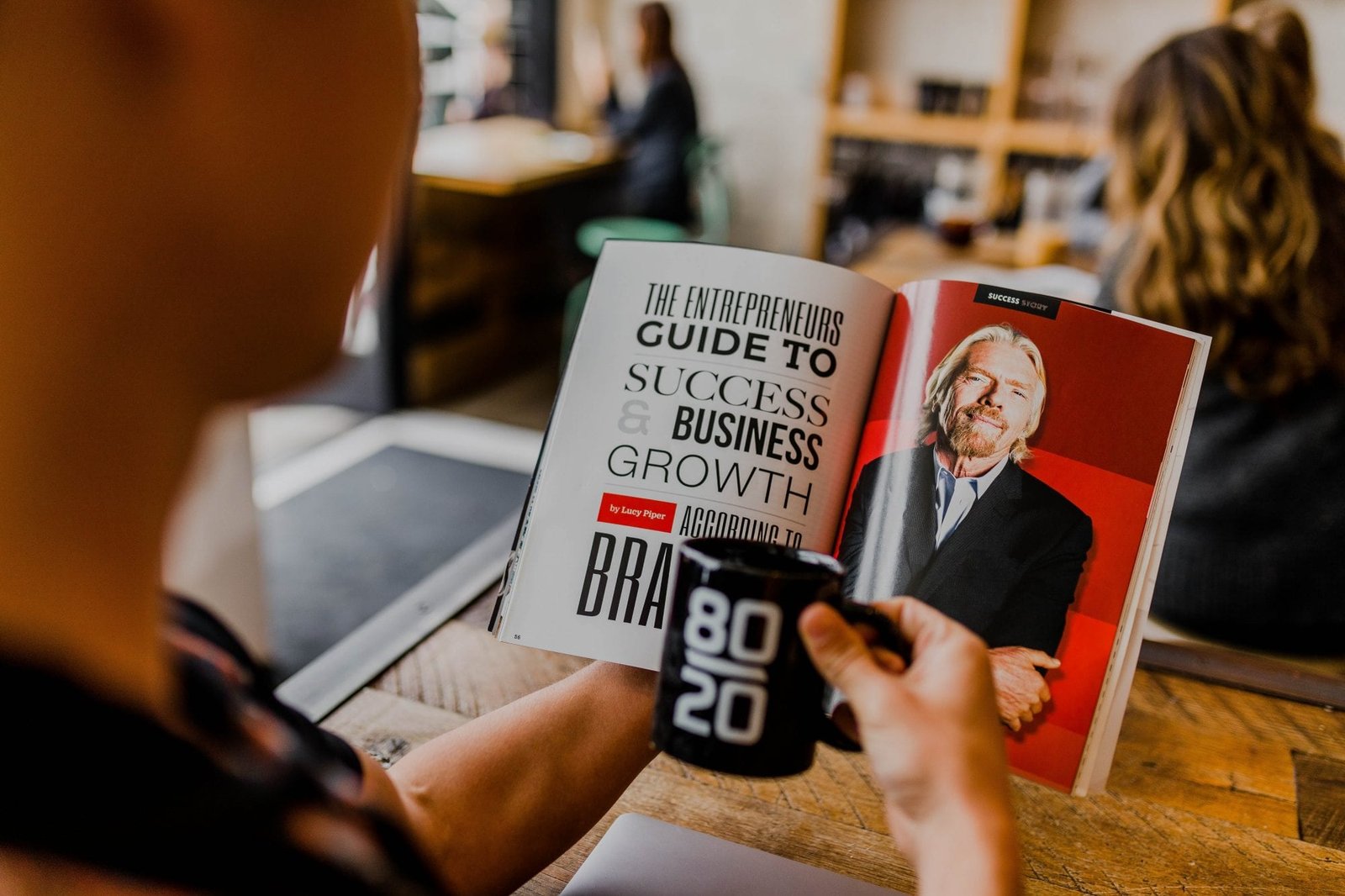 Personal Development Scams: When Self-Help Turns into an Addiction man reading magazine