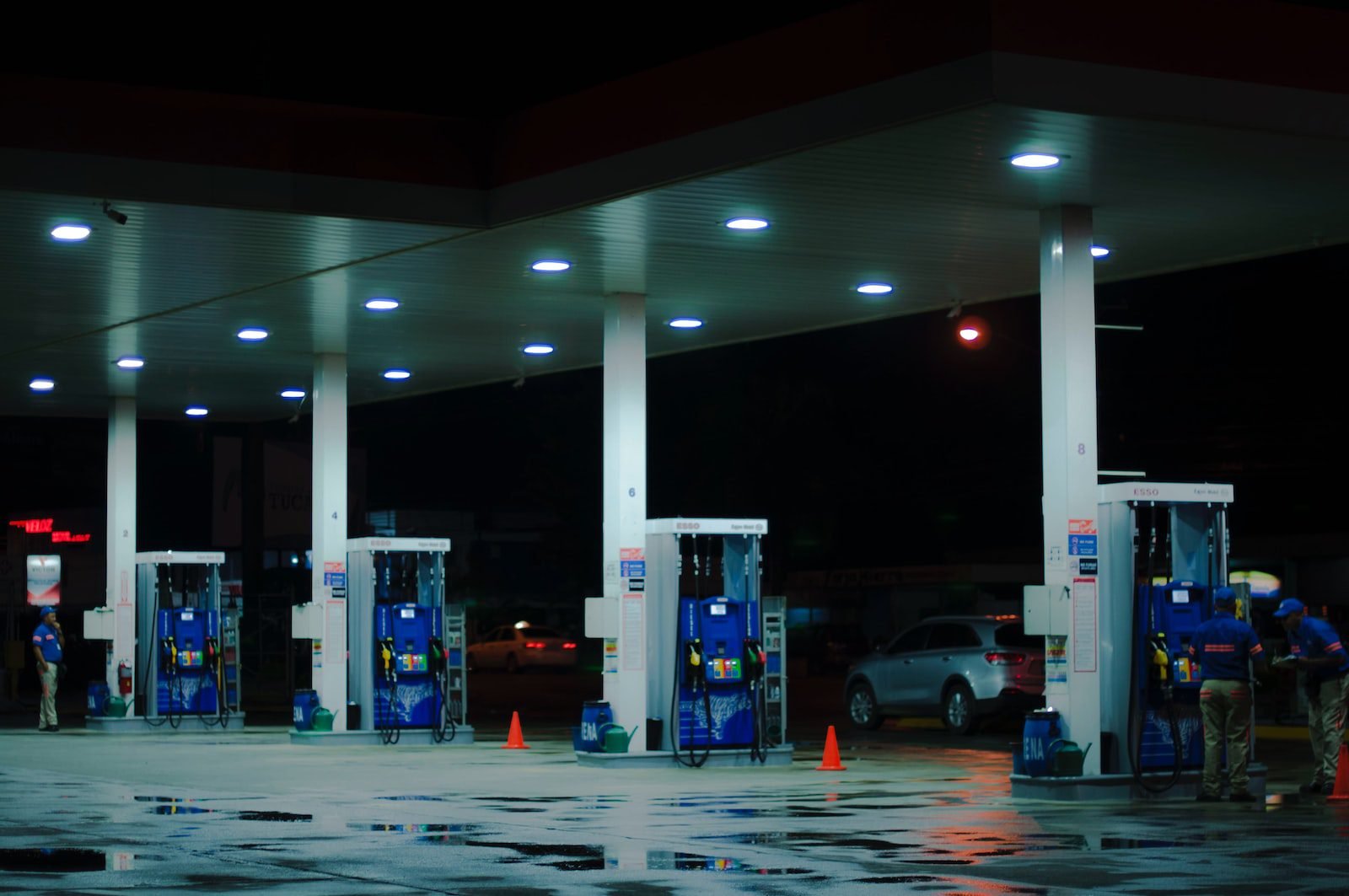 Ministry of Petroleum and Mineral Resources announces increase in fuel prices in Egypt person taking a photo of blue and white gasoline station