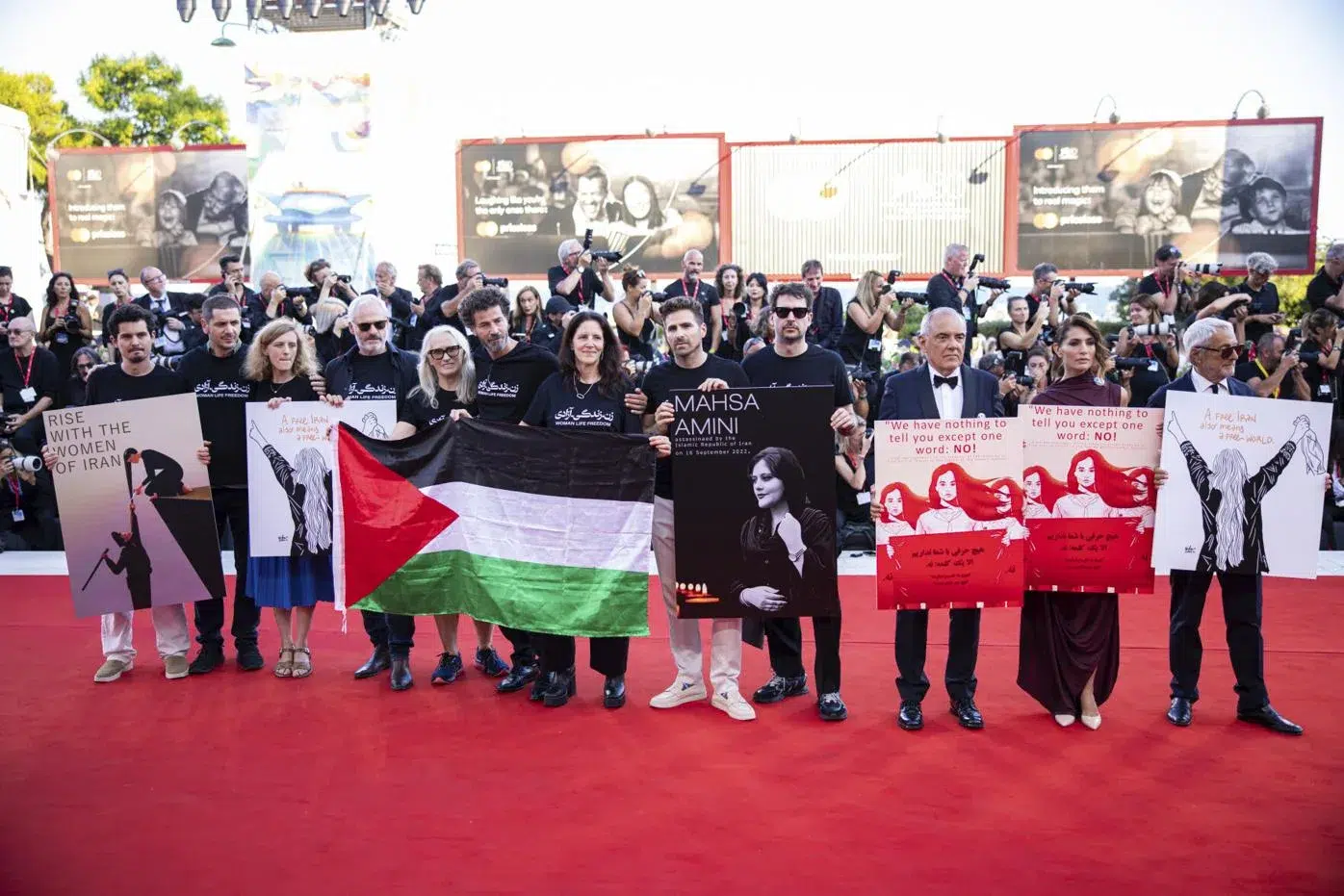 A Flashmob at Venice Film Festival's Red Carpet: Solidarity for Iran with Palestinian Flags and Representation A Flashmob at Venice Film Festival's Red Carpet Solidarity for Iran with Palestinian Flags and Representation