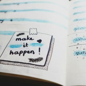 Close-up view of a planner page with motivational text and colorful designs.